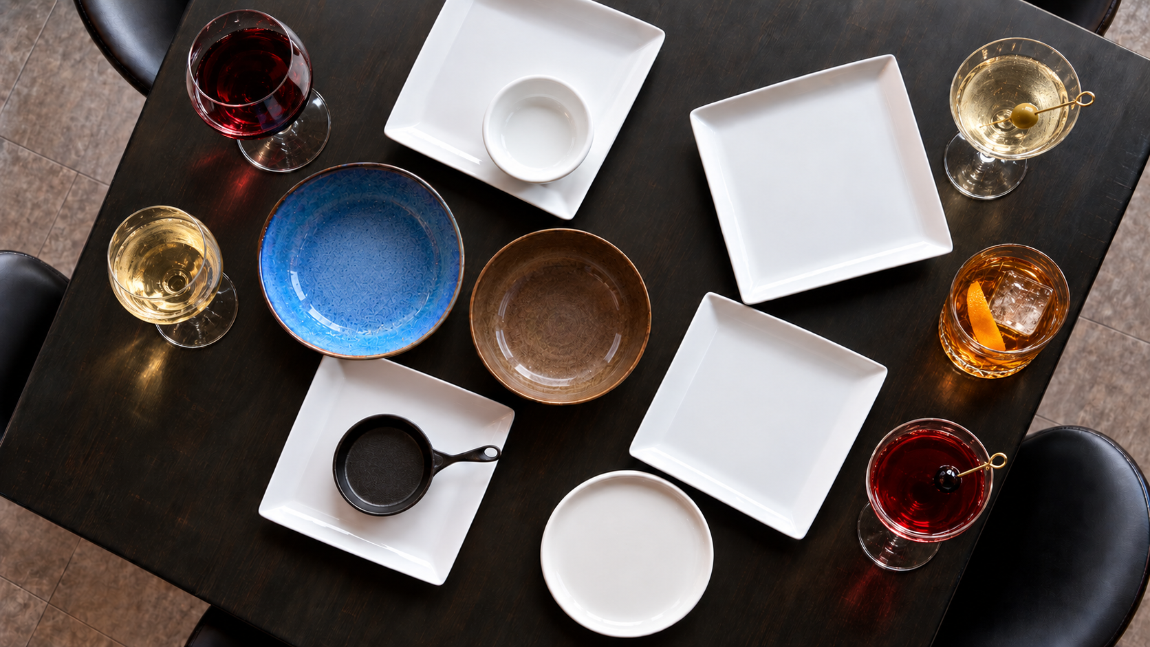 An overhead restaurant table set with empty plates